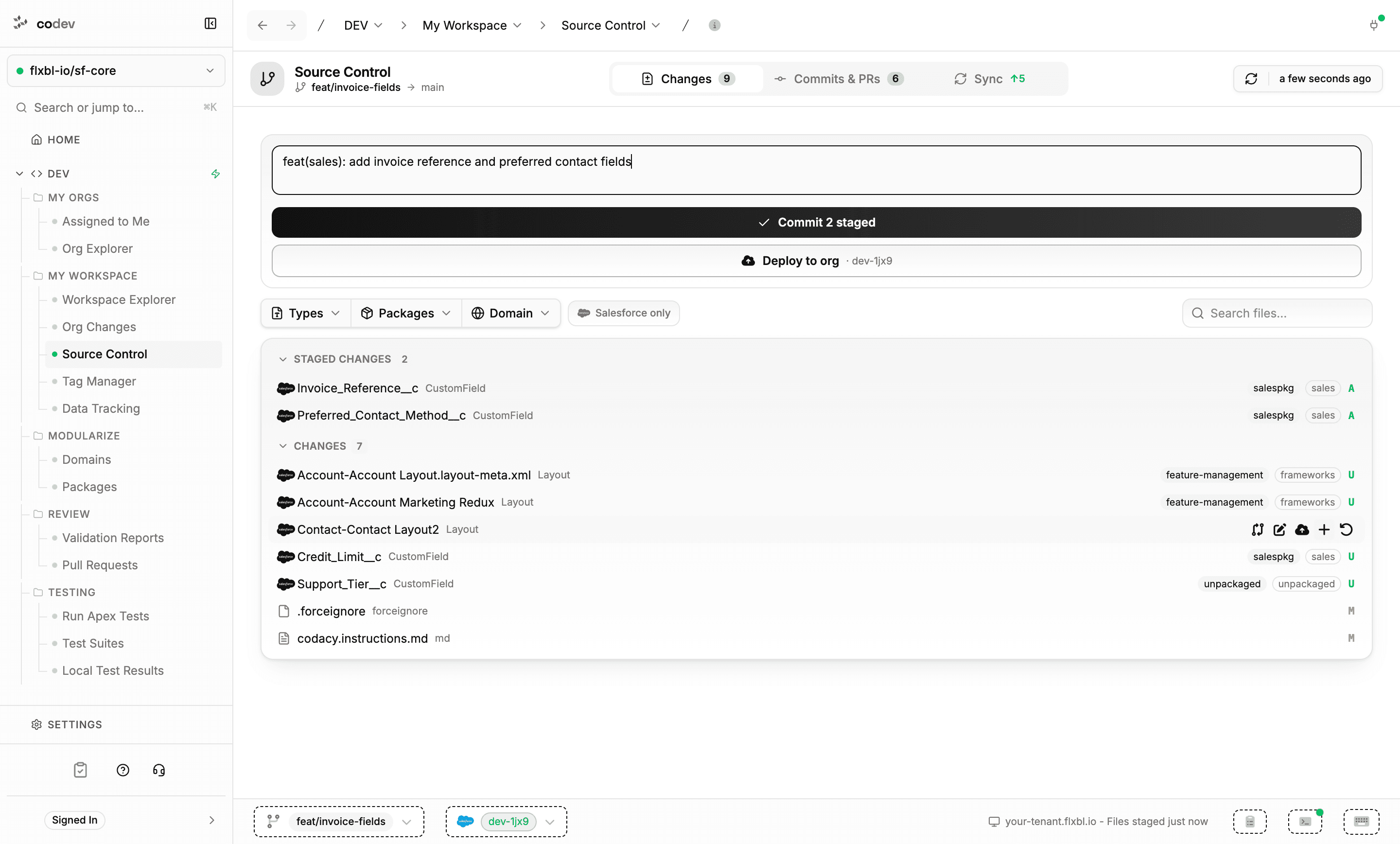 The Changes tab with two staged custom fields, a commit message, and the Commit 2 staged button enabled